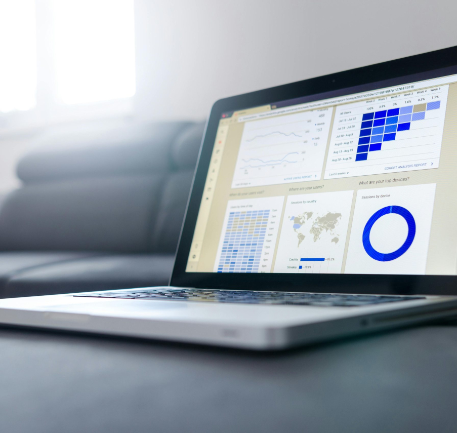 Sleek laptop showcasing data analytics and graphs on the screen in a bright room.